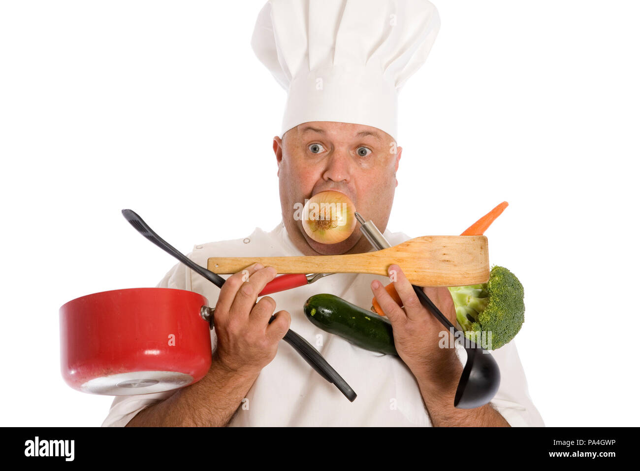 A busy chef struggling to keep up with the work load. Stock Photo