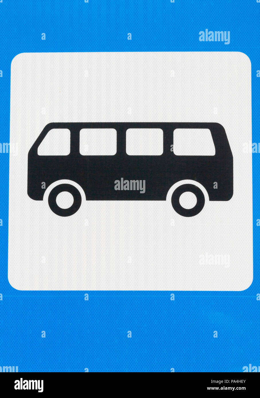 the designation of a black bus on a blue sign indicating the bus stop