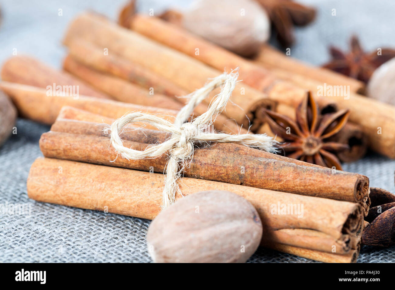 lying together cinnamon sticks, a few nutmeg and anise, which are used