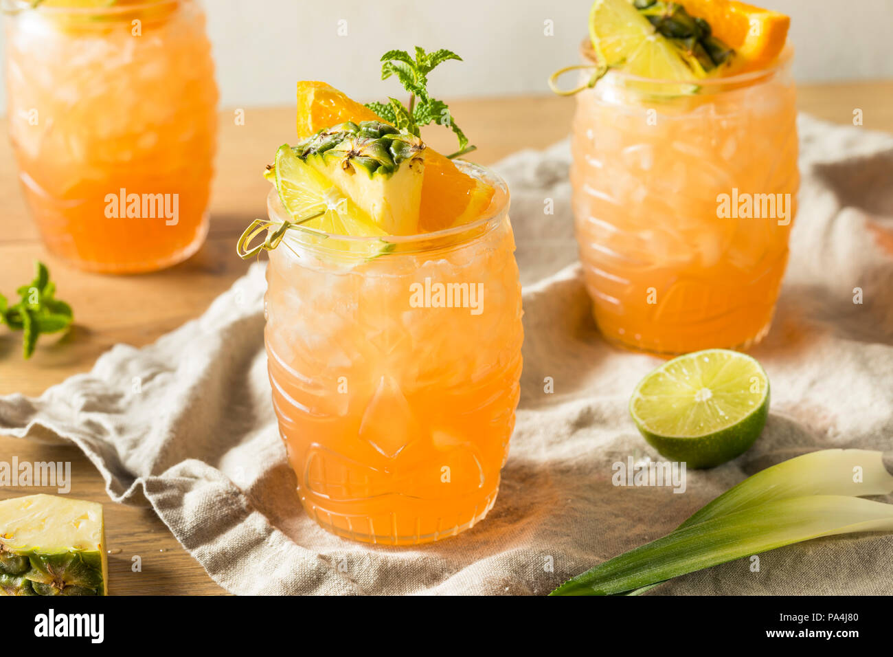 Refreshing Summer Tiki Cocktail Drink with Rum Lime and Pineapple Stock