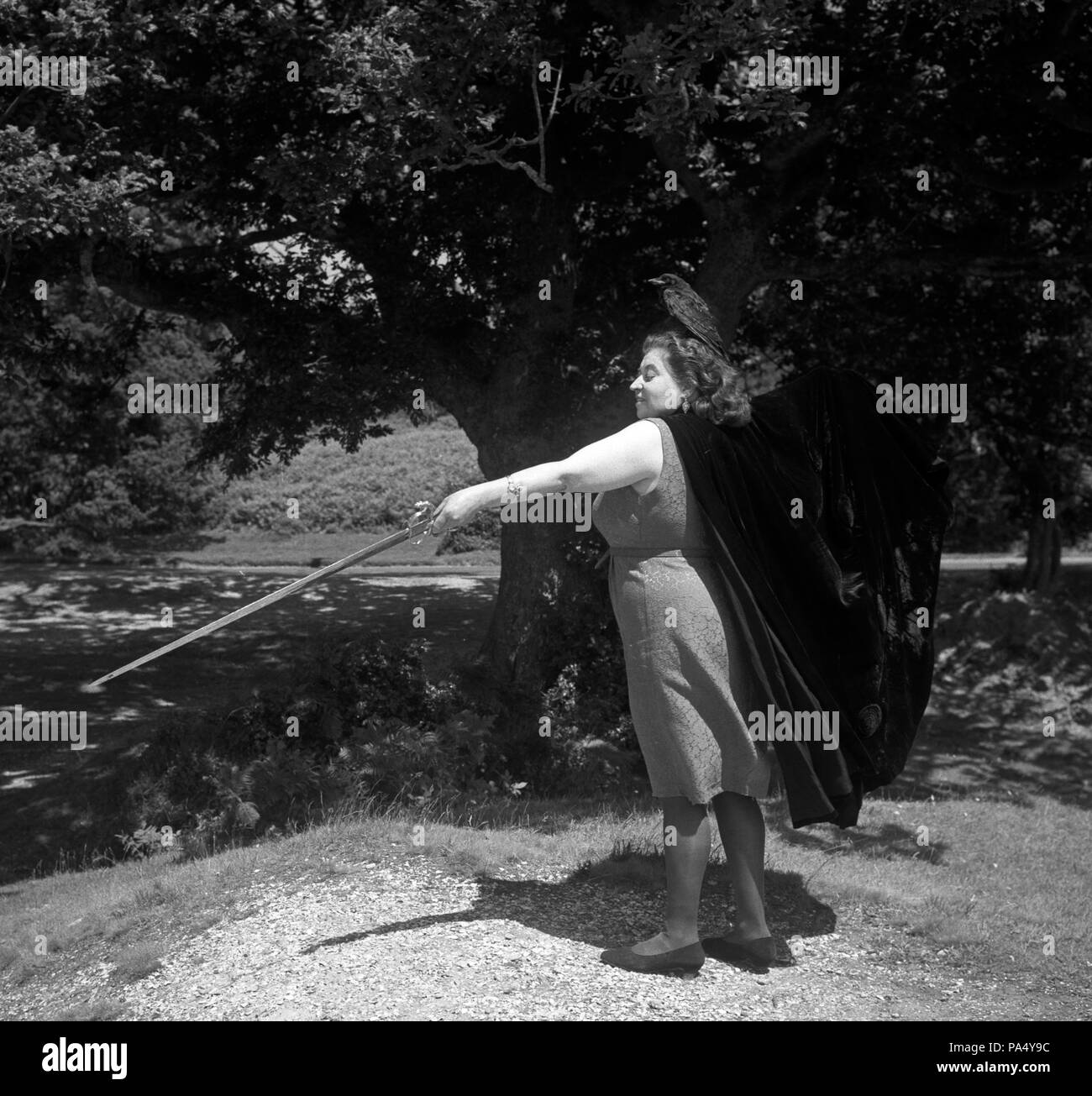 Sybil Leek, Chief Witch of the New Forest, with a ceremonial sword and