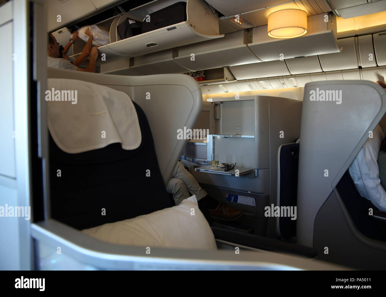 on board a BA flight, the view of club class (business class) seats on board a Boeing 777, UK Stock Photo