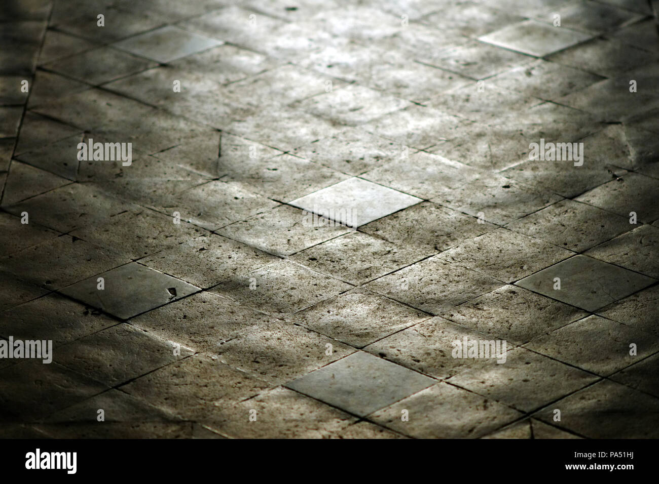 Victorian quarry floor tiles in a church aisle. Stock Photo