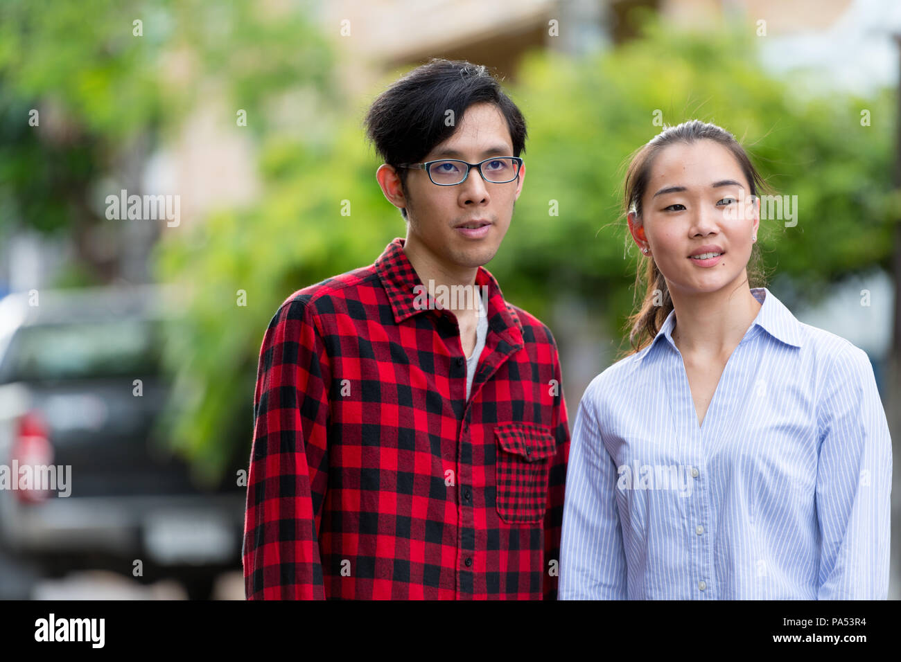 Young Asian couple outdoors Stock Photo