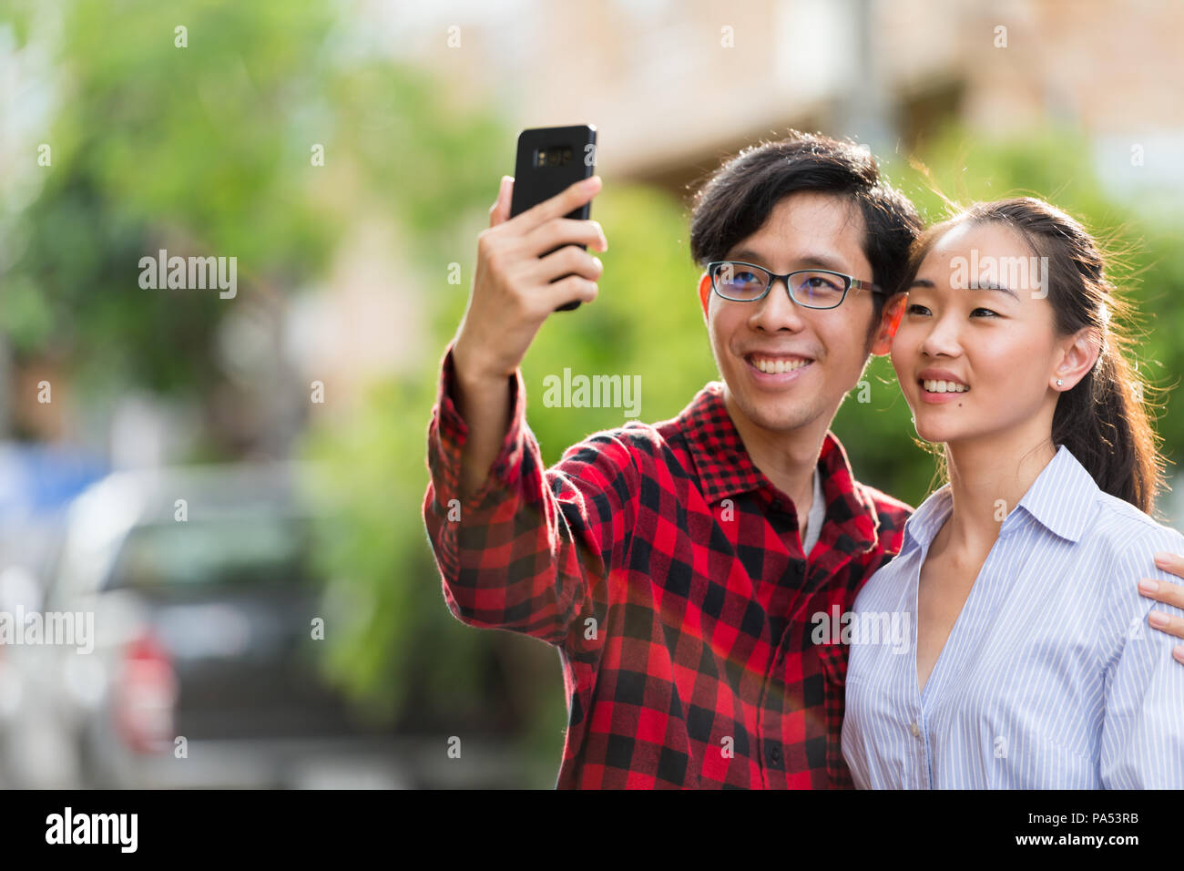 Cute young loving couple posing isolated over yellow background take a  selfie Stock Photo | Adobe Stock