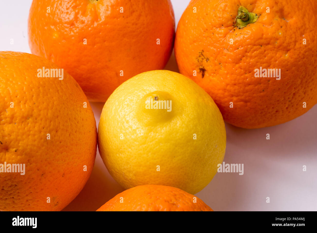 Bunch of Organic Oranges and lemon, close up and isolated Stock Photo