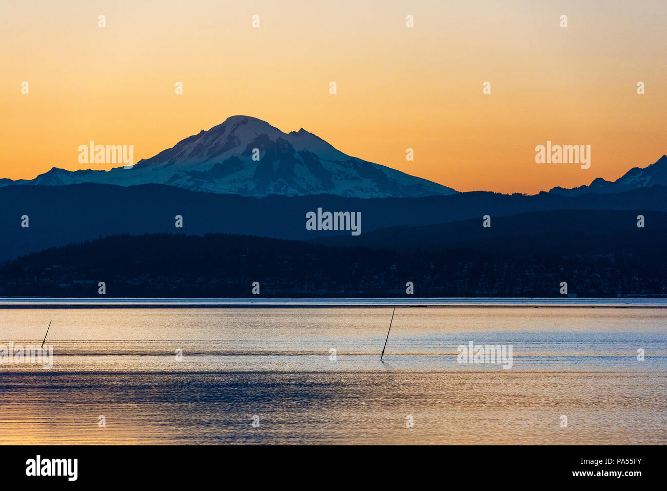 Sunrise over Mt. Baker across Bellingham Bay, Bellingham, Washington, Pacific Northwest, USA. Stock Photo