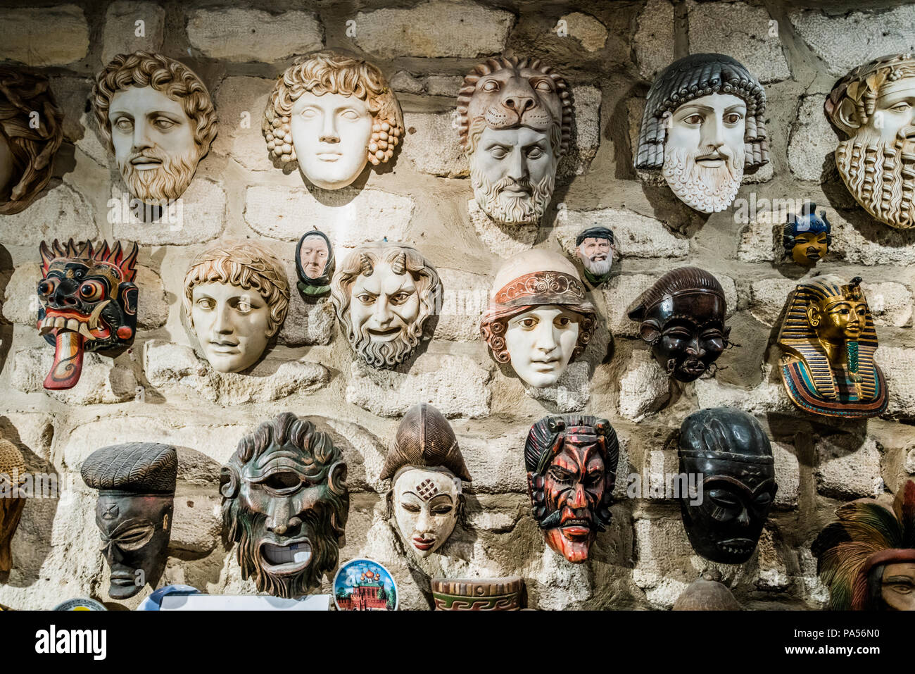 masks hanging on wall. Collection of masks Stock Photo Alamy