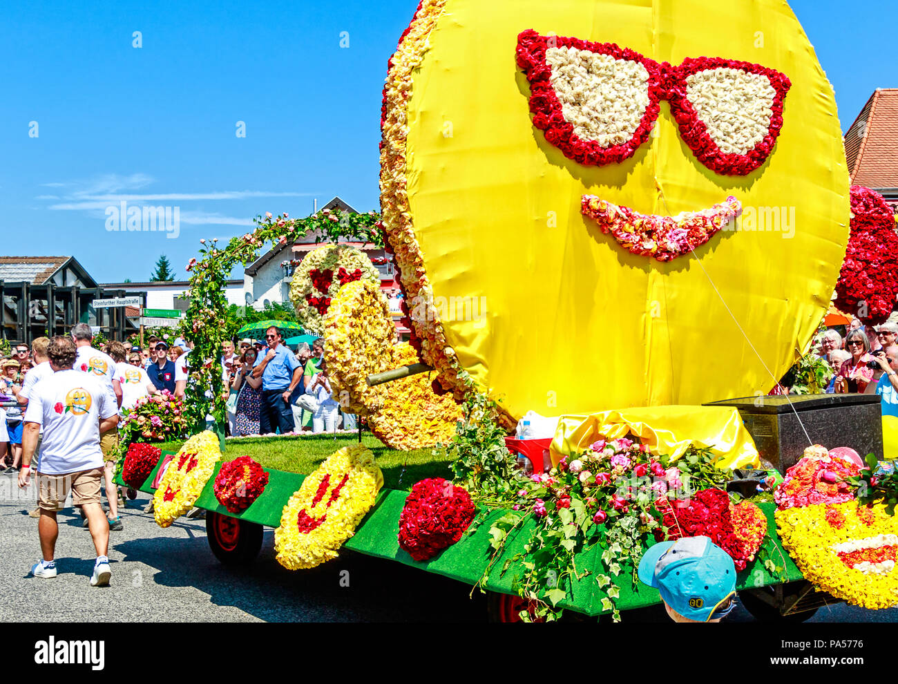 STEINFURTH, GERMANY-JULY 15, 2018 Enormous smiley on a parade carriage. Germany's 'Rose Village' Steinfurth celebrates 150 years of rose cultivation. Stock Photo