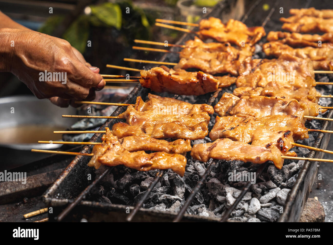 Premium Photo  Closeup of grilled skewered milk pork on stick thai street  food market