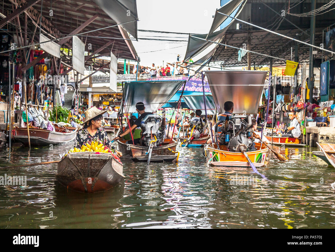 Damnoen Saduak (Thailand) - 7 June 2017: Lots of tourists are visiting the famous Damnoen Saduak Floating Market, the most popular floating market in  Stock Photo