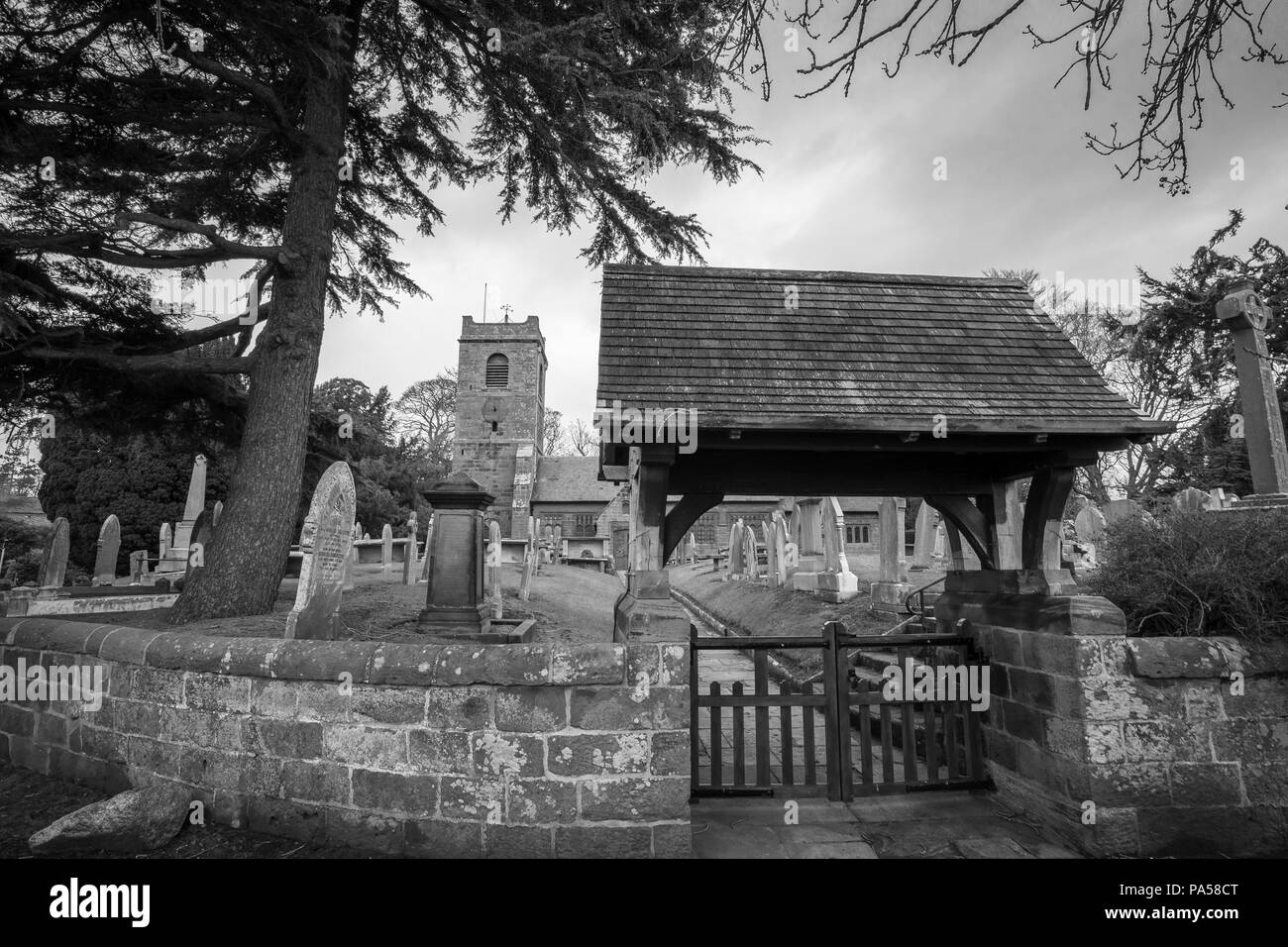Black and white picture of a church and church yard, Cheshire UK Stock Photo