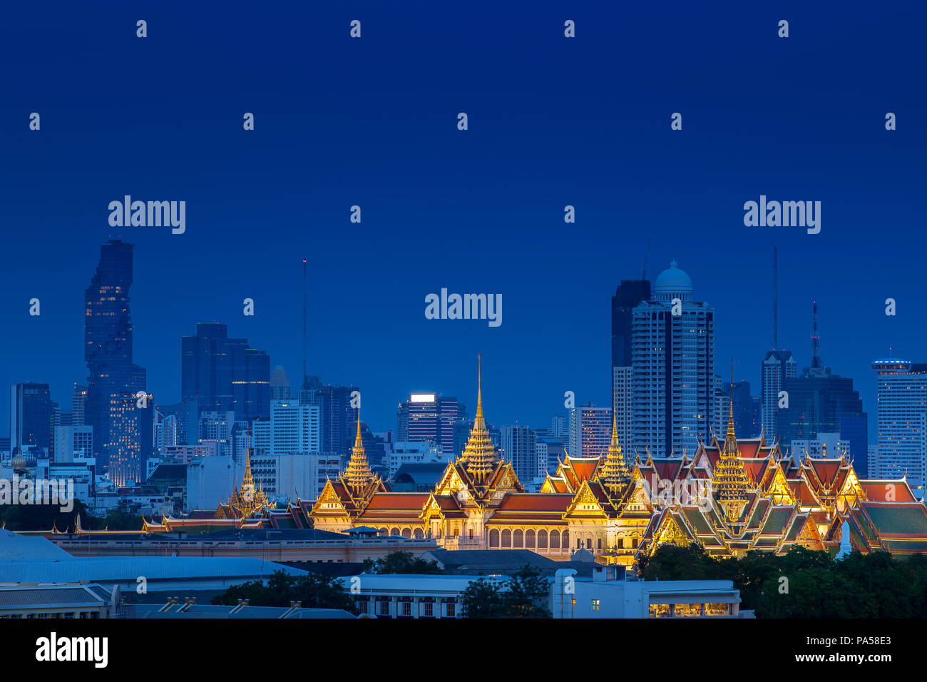 Aerial view of Royal Grand Palace on Bangkok, Thailand with luxury skyline, and condo in downtown at night after sunset time Stock Photo