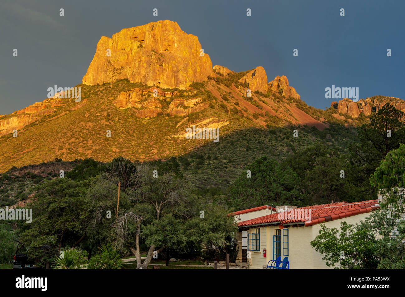 Sunset over Casa Grande Mountain in Chisos Mountain Basin in Big Bend National Park Stock Photo