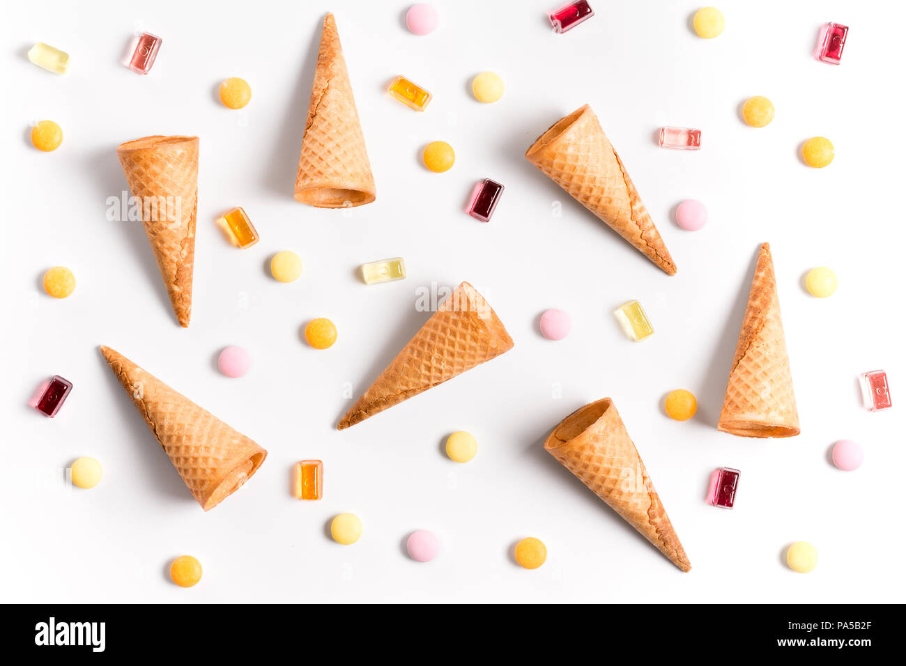 Ice crean cones and candy lay flat image wallpaper Stock Photo