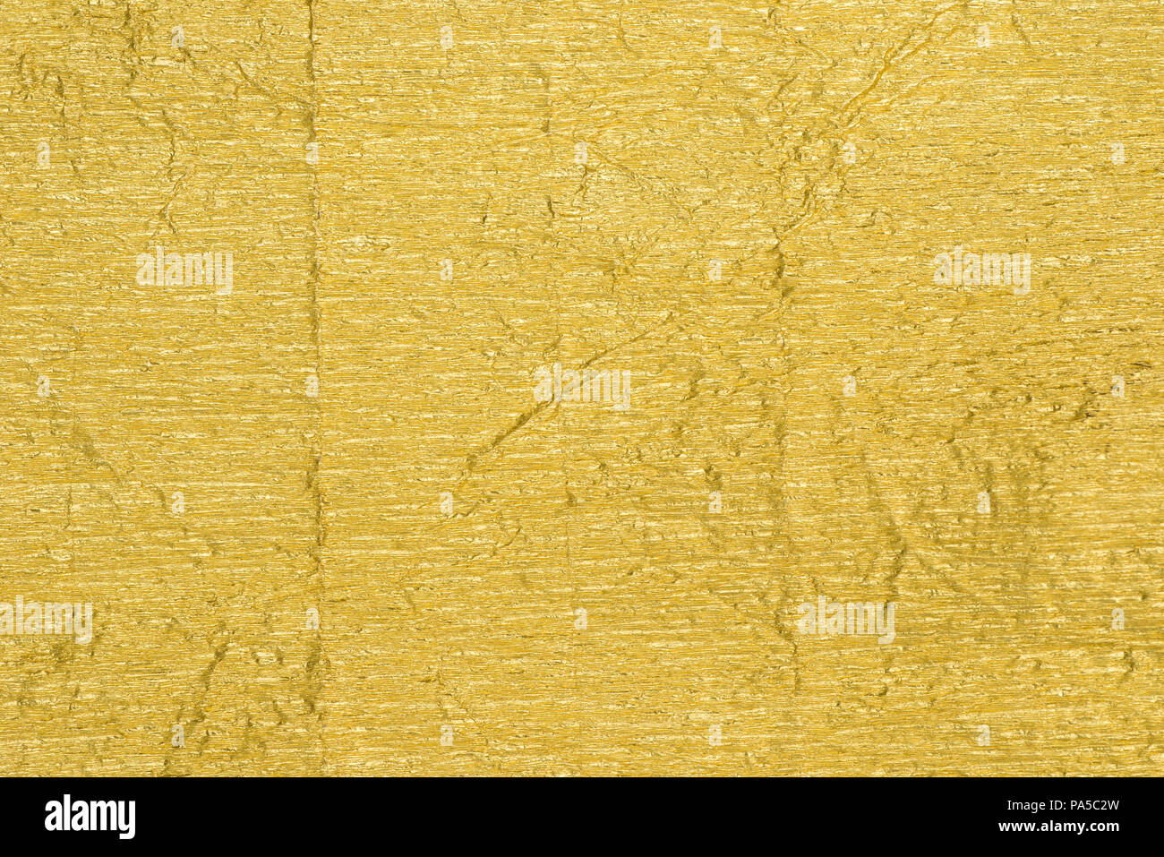 golden color creased metallic foil background texture Stock Photo