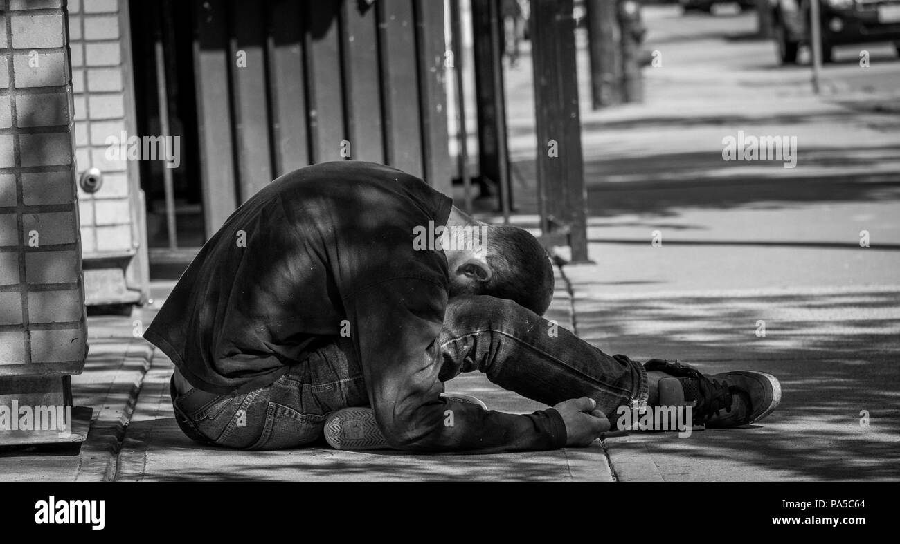 Young man passed out on sidewalk in downtown Seattle Stock Photo Alamy