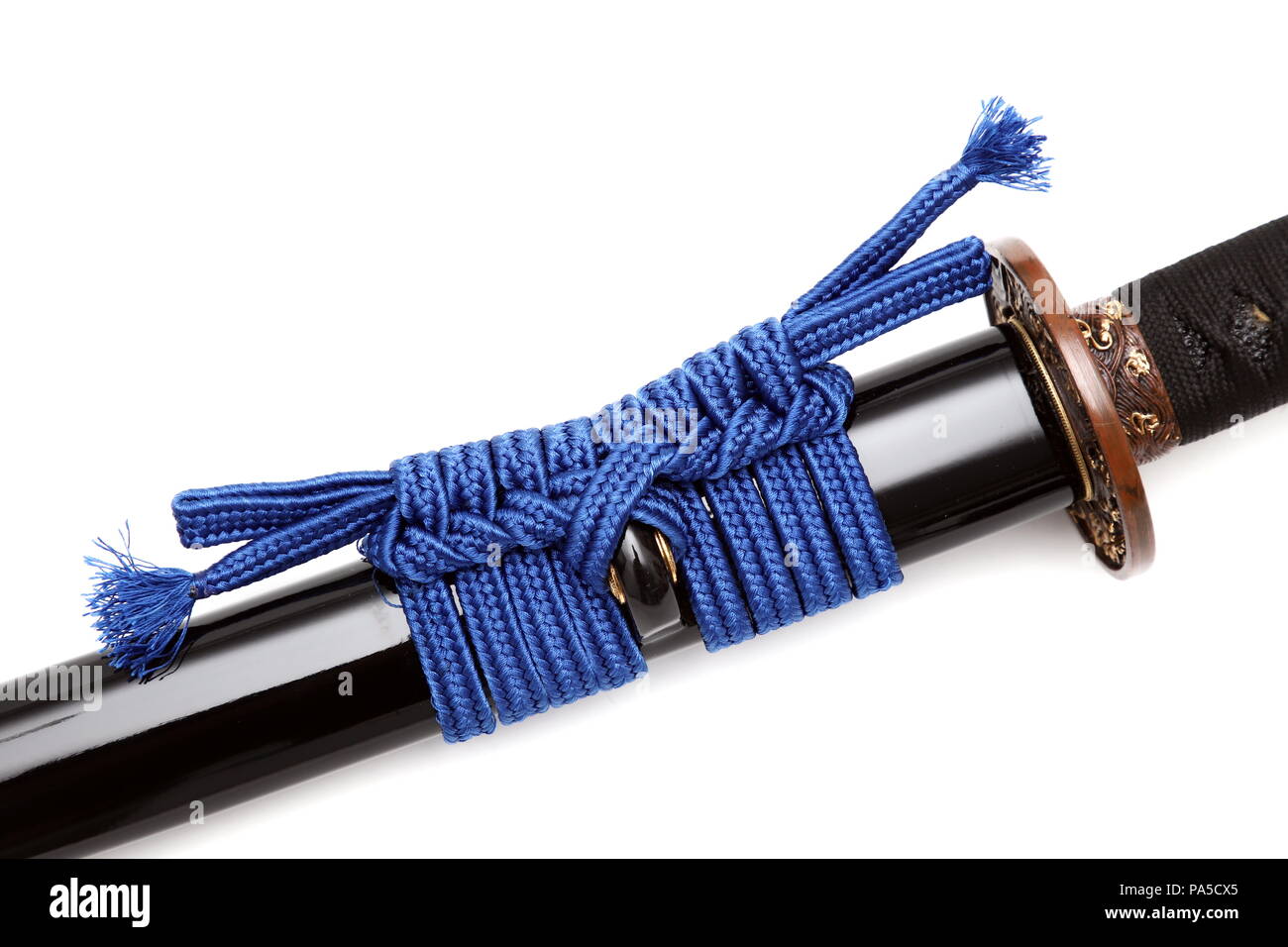 Sageo is a cord made of silk or cotton going through the Kurigata of the Saya (scabbard), that keeps the sword in the belt. isolated in white backgrou Stock Photo