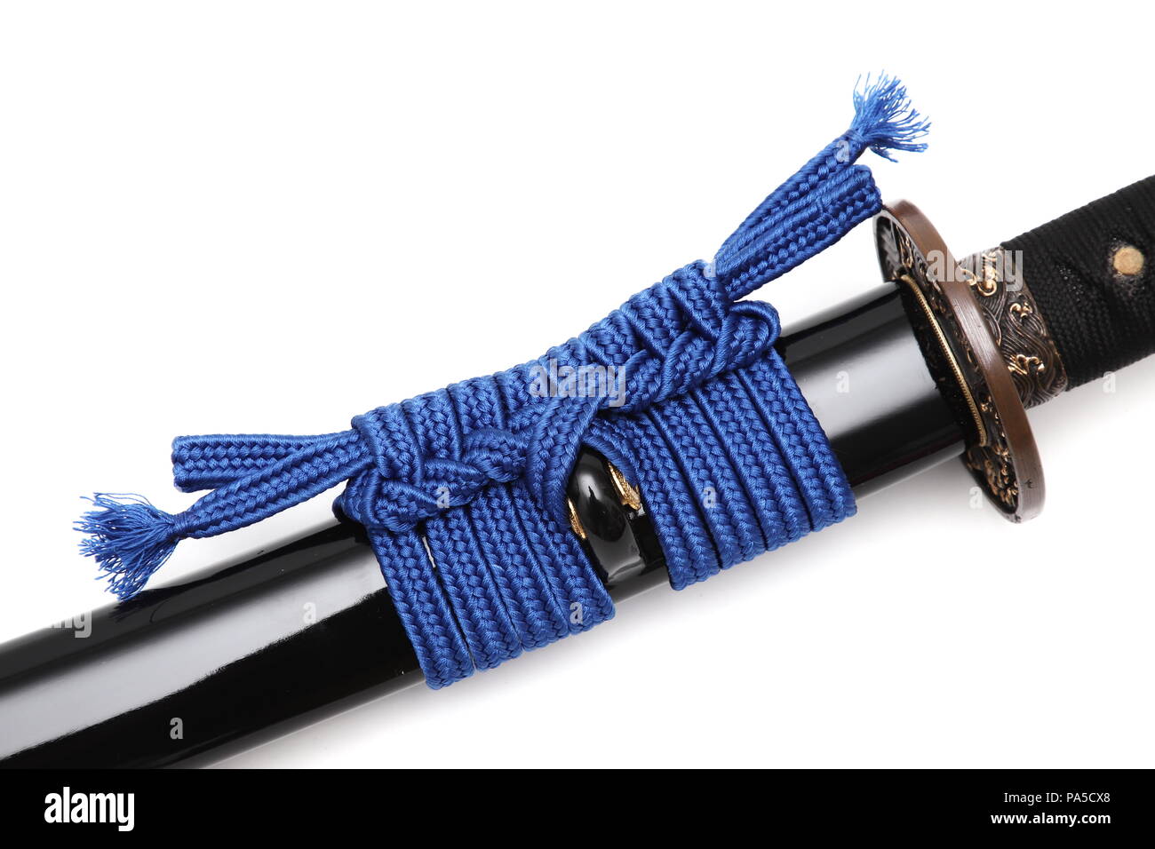Sageo is a cord made of silk or cotton going through the Kurigata of the Saya (scabbard), that keeps the sword in the belt. isolated in white backgrou Stock Photo