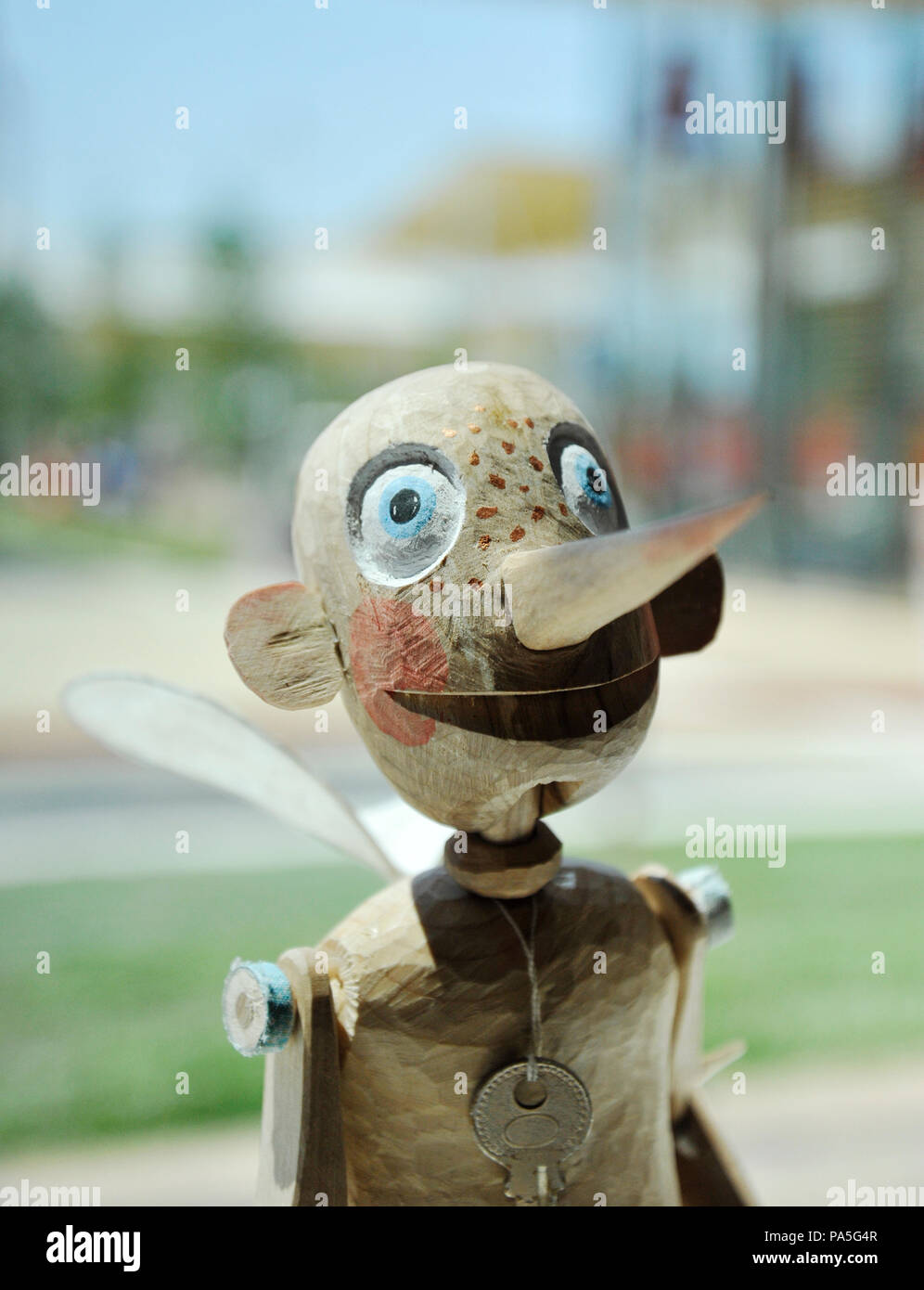 Traditional wooden pinocchio made by hand with fairy wings and a key to ...
