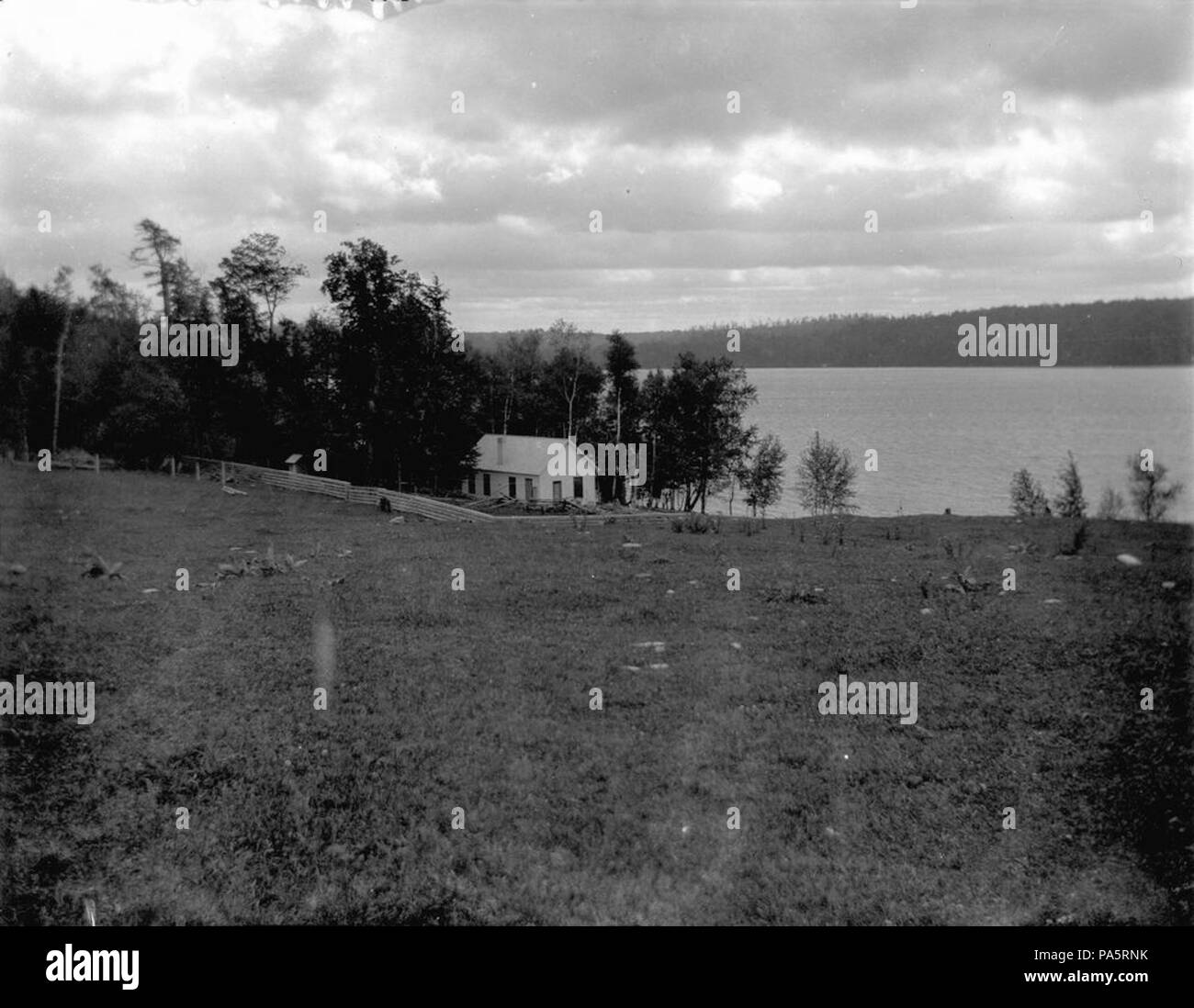 . English: EH597N n.d.Windmere cottage. Walloon Lake, Michigan. [Several white spots and curling around the top left appear on image due to warping of original negative.]Early Years, 1899-1921: Box 1 Folder 22Please credit: 'Photographer unknown. Papers of Ernest Hemingway. Photograph Collection. John F. Kennedy Presidential Library and Museum, Boston.'   This is an image of a place or building that is listed on the National Register of Historic Places in the United States of America. Its reference number is 68000026   . circa 1920 625 Ernest Hemingway Cottage EH3 Stock Photo