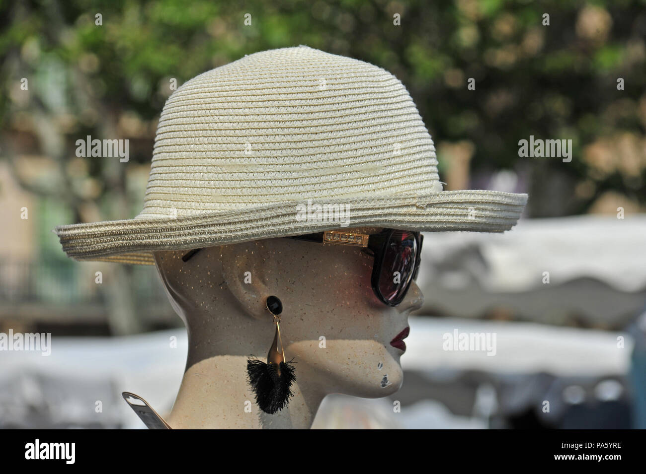 Women's Hat on the head of a female Mannequin in the market in Beziers, France Stock Photo