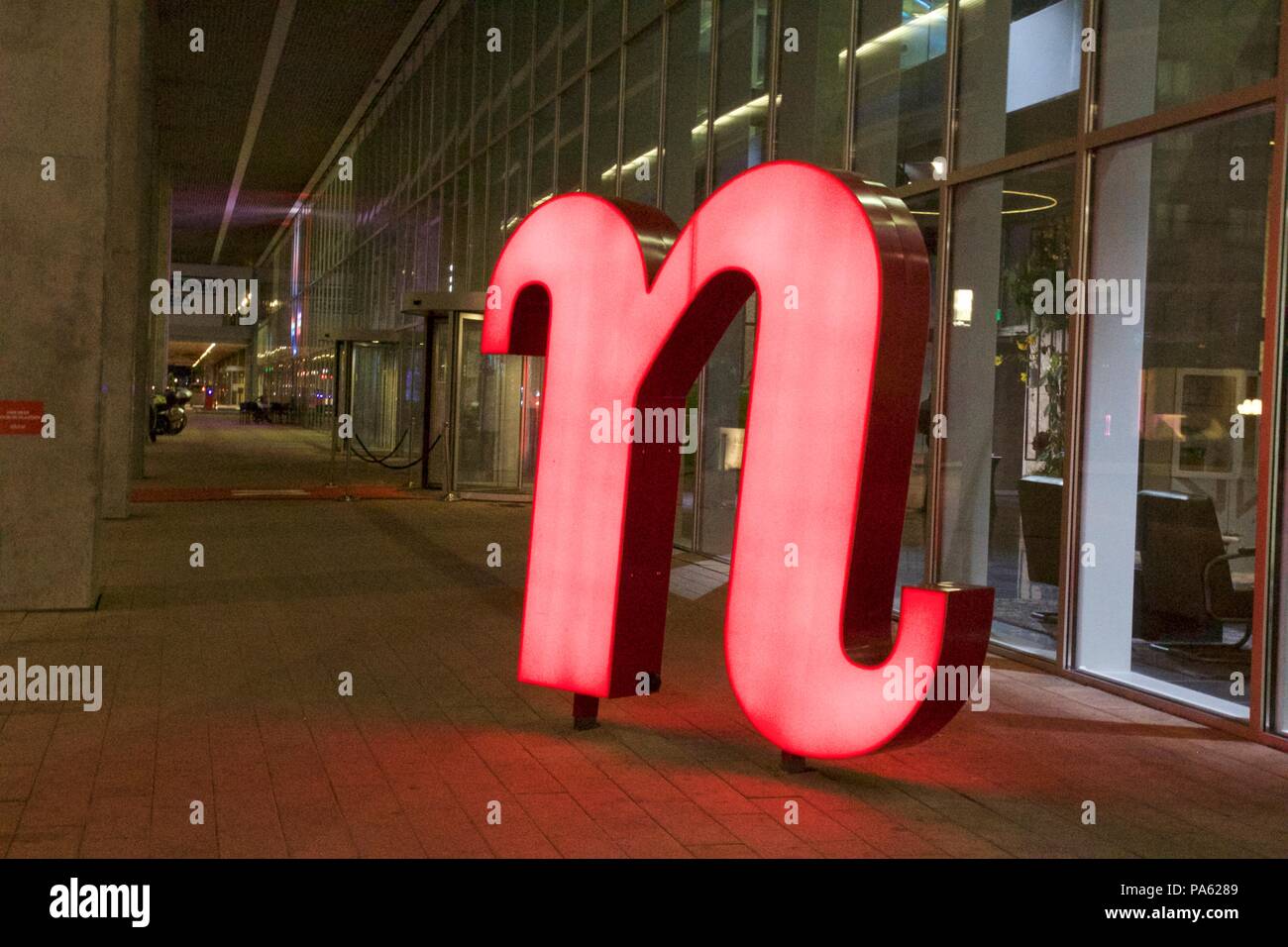 A red n statue sign outside nhow Rotterdam, part of NH Hotels Stock Photo