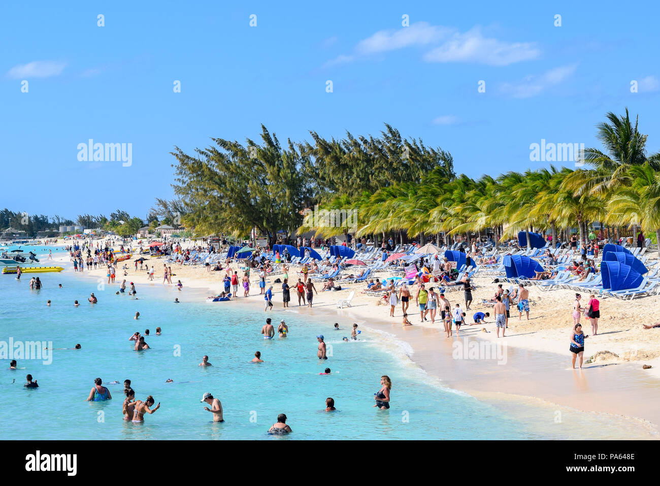 Grand Turk, Turks and Caicos Islands - April 03 2014: Crowded day at Cruise Center Beach (SunRay Beach) in Grand Turk. Stock Photo