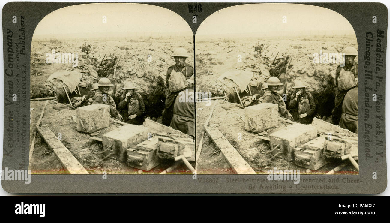 . English: Horizontal, sepia stereocard showing uniformed Scottish soldiers in a trench with boxes of supplies in the foreground. Keystone Stereograph number V18862. The title reads: 'Steel-helmeted Scots Entrenched and Cheerily Awaiting a Counterattack.' Title: 'Scots Entrenched and Cheerily Awaiting a Counter-Attack.' . between circa 1914 and circa 1918 5 &quot;Scots Entrenched and Cheerily Awaiting a Counter-Attack.&quot; Stock Photo