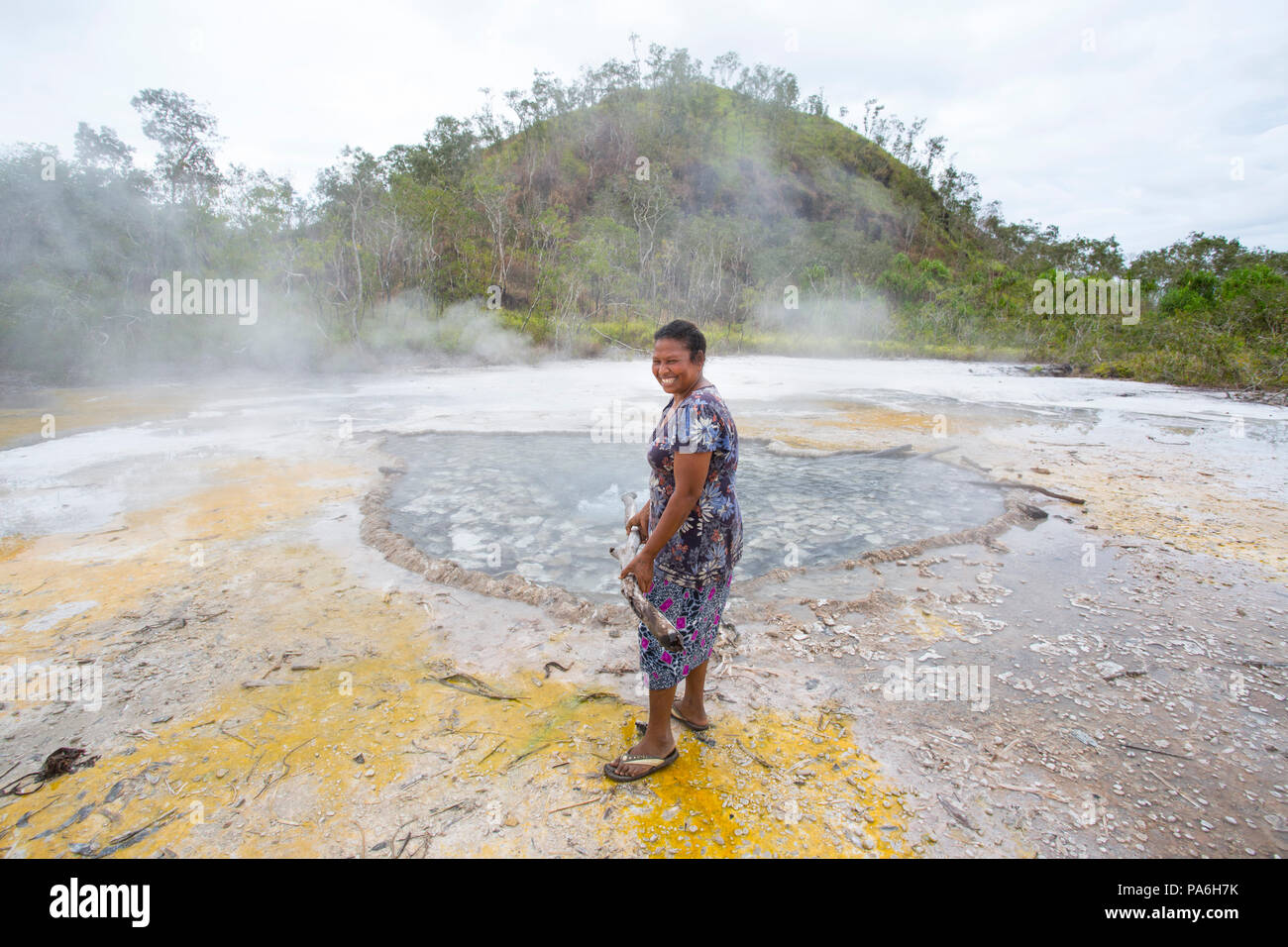 Fergusson Island locals cooking food on natural Hot Springs, Papua New Guinea Stock Photo