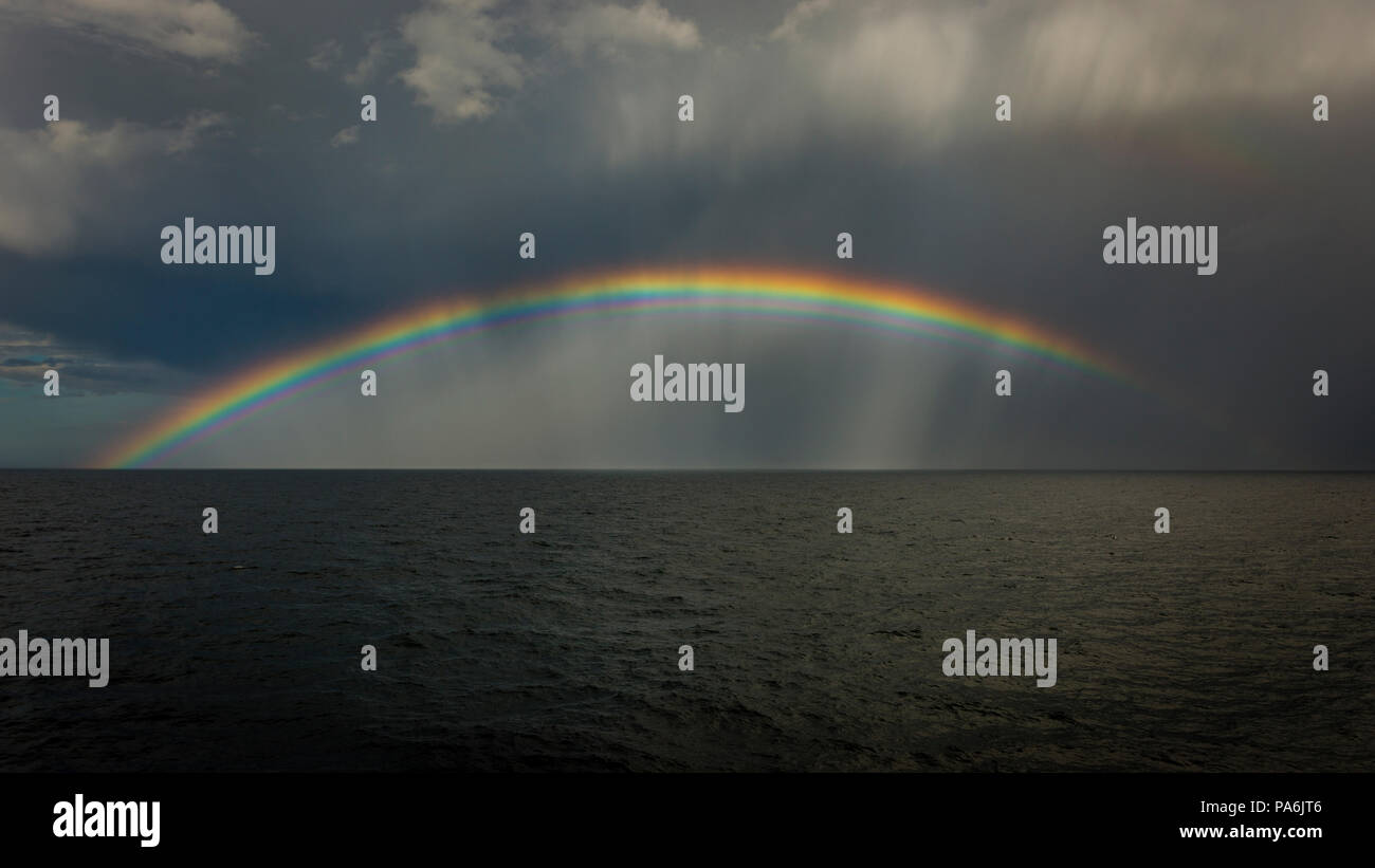 Storm clouds and rainbow over the North Sea Stock Photo