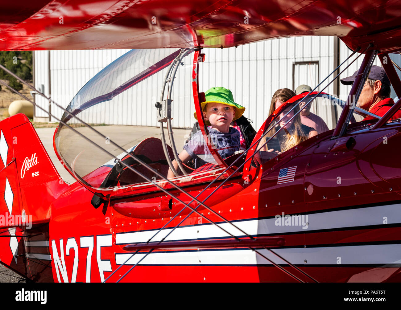 Young boy inspecting Pitts Special S2C biplane; Salida Fly-in & Air Show; Salida; Colorado; USA Stock Photo