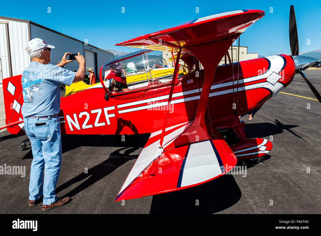 Visitor photographing Pitts Special S2C biplane; Salida Fly-in & Air Show; Salida; Colorado; USA Stock Photo