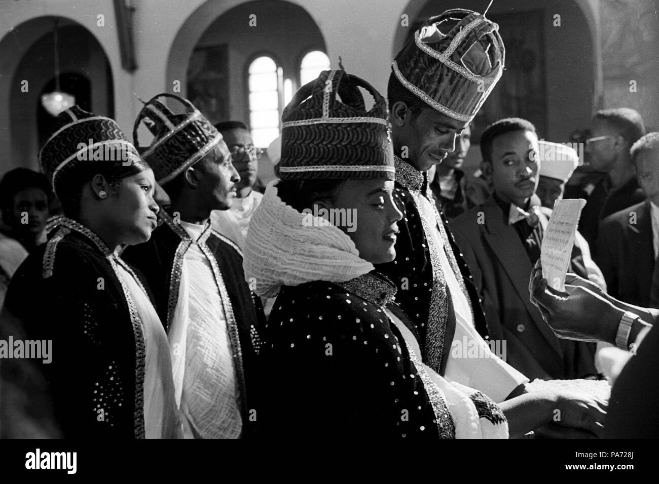 Asmara, Eritrea. 2nd Nov, 1999. At St. Mary's church in Asmara, couples exchange vows during an Orthodox service, marking the last opportunity to marry before the Christmas 40-day fast. Young women are marrying later and choosing their husbands, rather than submitting to the arranged marriages in adolescence, as tradition once required. Credit: Cheryl Hatch/ZUMAPRESS.com/Alamy Live News Stock Photo