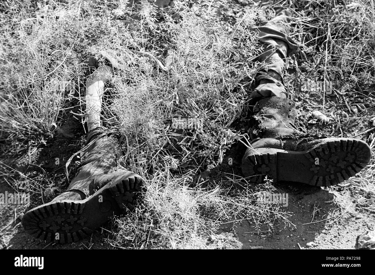 Tserona, Eritrea. 2nd Nov, 1999. The leg bones of an Ethiopian soldier protrude from his boots along the Eritrean trenches at Egri Mikhal on the border near Tserona. Credit: Cheryl Hatch/ZUMAPRESS.com/Alamy Live News Stock Photo
