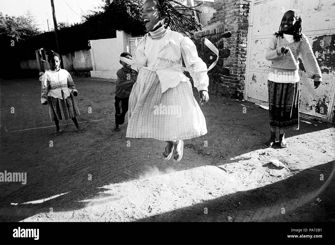 Asmara, Eritrea. 2nd Nov, 1999. An Eritrean girl jumps rope in a street in the capital, Asmara. The daily life in the city continues while war wages on the border 60 miles away. Credit: Cheryl Hatch/ZUMAPRESS.com/Alamy Live News Stock Photo