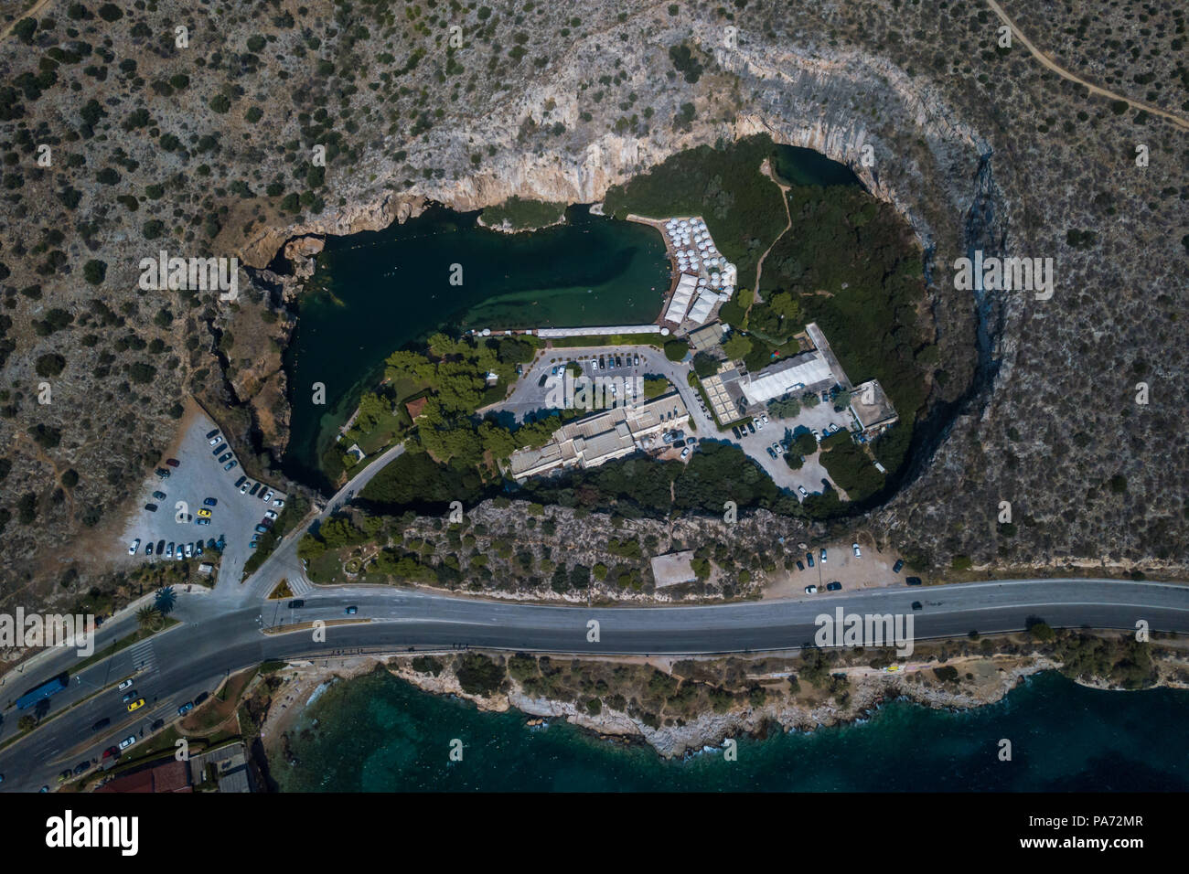 Athens. 19th July, 2018. Photo taken on July 19, 2018 with drone shows a general view of Vouliagmeni Lake in south region of Athens, Greece. Situated on an idyllic landscape, the rare geological phenomenon of the Vouliagmeni Lake attracts many visitors. Credit: Xinhua /Lefteris Partsalis/Xinhua/Alamy Live News Stock Photo
