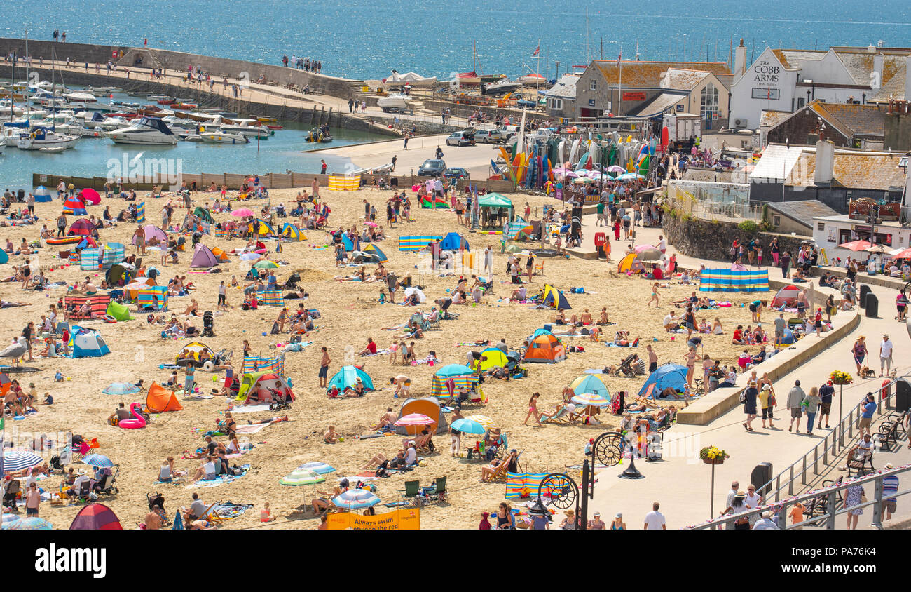 Lyme Regis, Dorset, UK. 21st July 2018.  UK Weather: Very hot and humid in Lyme Regis.  Families flock to the beach on the first day of the school summer holidays to enjoy the hot sunshine at the seaside resort of Lyme Regis as the heatwave continues. Credit: Celia McMahon/Alamy Live News Stock Photo
