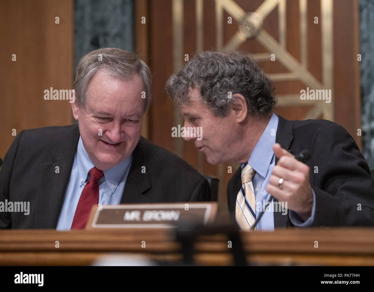 July 19, 2018 - Washington, District of Columbia, United States of America - United States Senators Mike Crapo (Republican of Idaho), left, Chairman, US Senate Committee on Banking, Housing and Urban Affairs, left, and Sherrod Brown (Democrat of Ohio), right, Ranking Member, converse prior to hearing testimony from Kathleen Laura Kraninger, on her nomination to be Director, Bureau of Consumer Financial Protection (CFPB), and Kimberly A. Reed on her nomination to be President, Export-Import Bank, before the on Capitol Hill in Washington, DC on Thursday, July 19, 2018.Credit: Ron Sachs/CNP ( Stock Photo