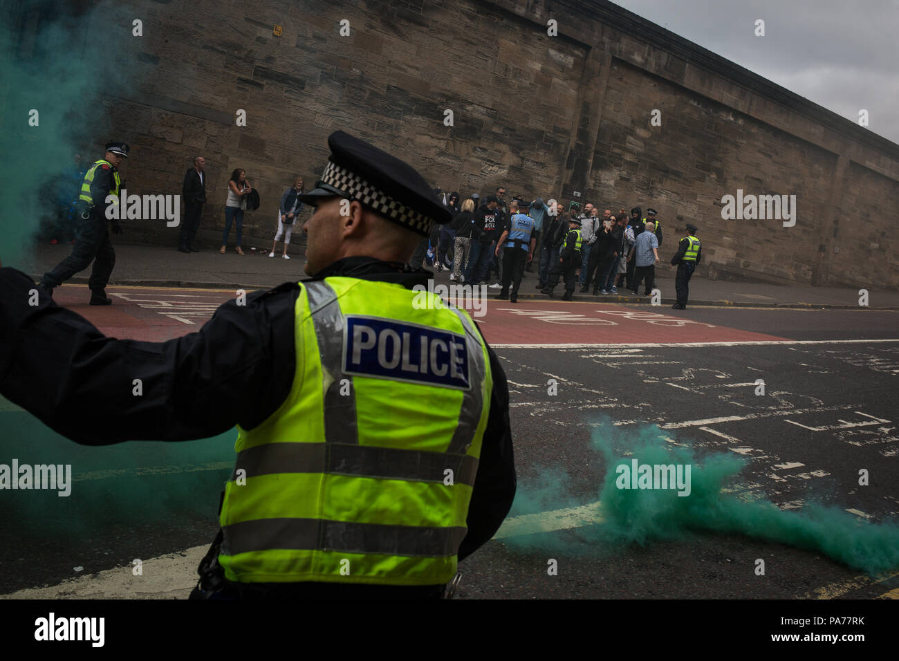 Glasgow, Scotland, on 21 July 2018. A protest by the far right Scottish Defence League, and counter demonstration by the United Against Facism groups, in George Square, Glasgow, Scotland.  Mounted police and police with dogs separated the two groups as the Scottish Defence League espoused their anti-immigrant rhetoric and accused immigrants of running grooming gangs. Image credit: Alamy News. Stock Photo