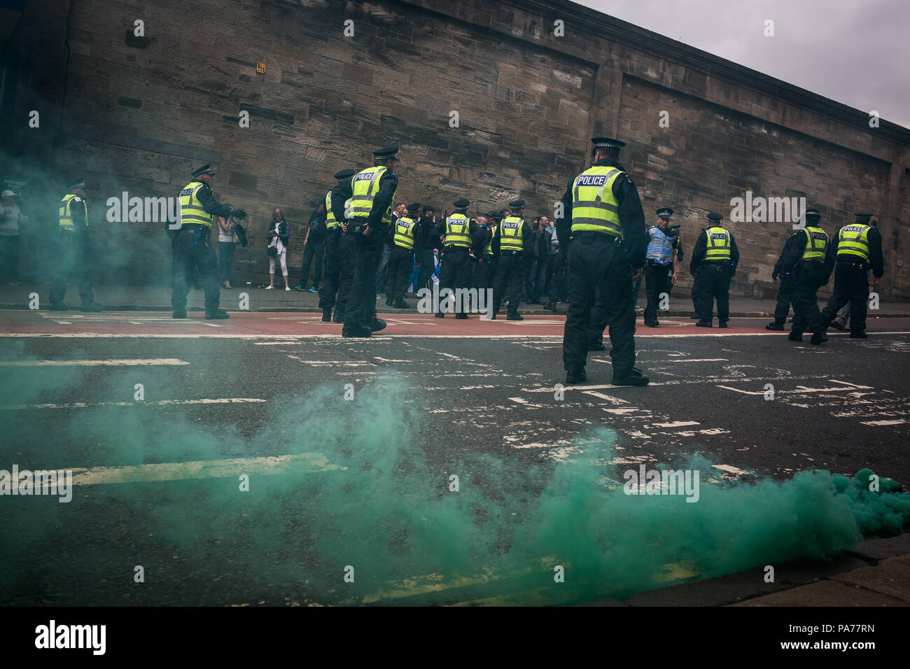 Glasgow, Scotland, on 21 July 2018. A protest by the far right Scottish Defence League, and counter demonstration by the United Against Facism groups, in George Square, Glasgow, Scotland.  Mounted police and police with dogs separated the two groups as the Scottish Defence League espoused their anti-immigrant rhetoric and accused immigrants of running grooming gangs. Image credit: Alamy News. Stock Photo