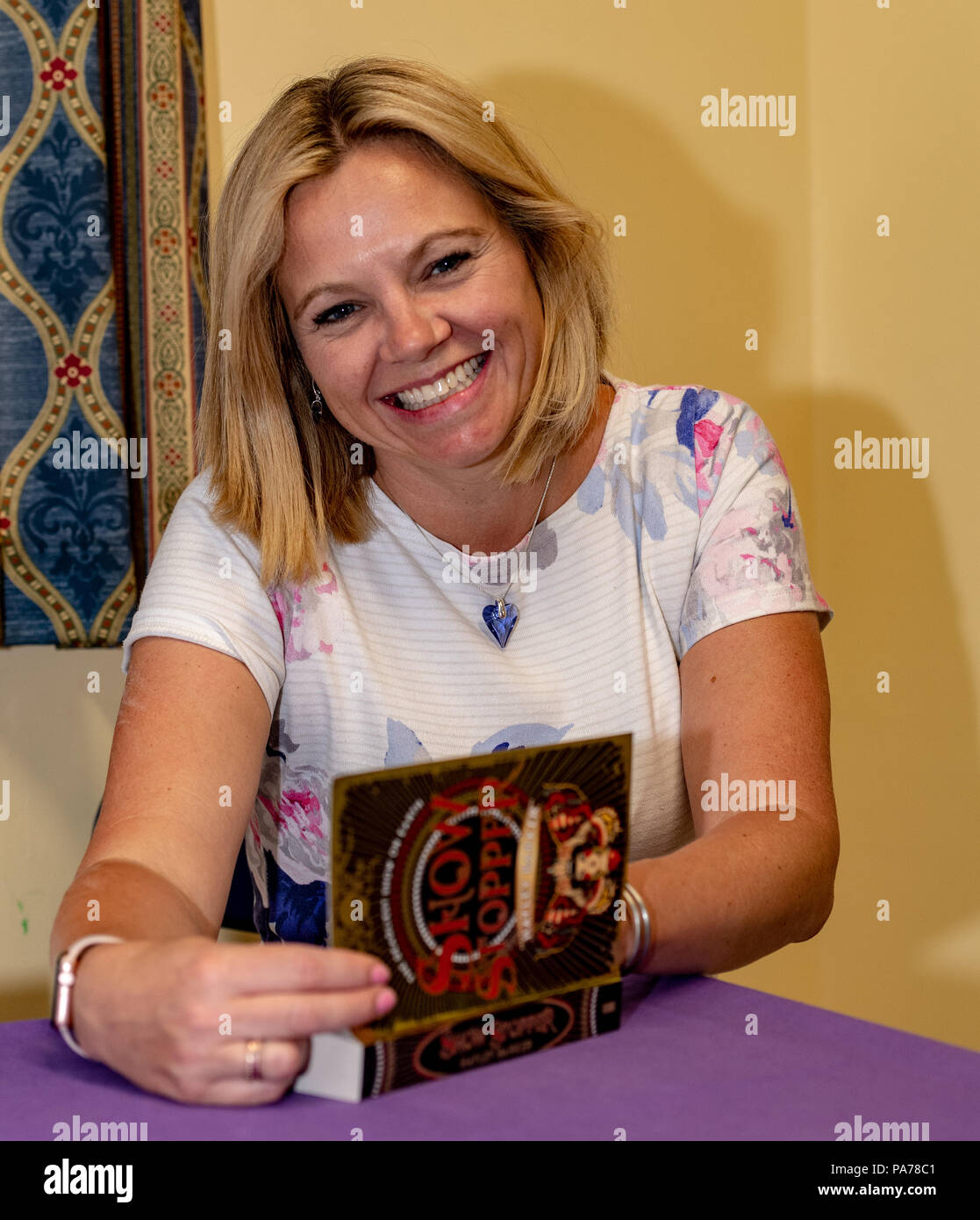 Brentwood Essex, 21st July 2018 Brentwood Children's Literary festival starts with author Hayley Barker (talking about her best selling book show Stopper and her new book Show stealer  Signing a book for a fan  Credit Ian Davidson/Alamy Live News Stock Photo