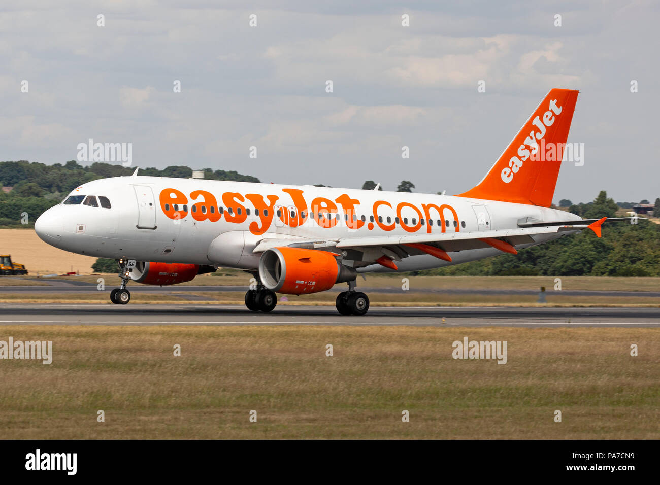 An easy jet Airbus A319 aircraft, G-EZBE, touching down at London Luton Airport in England. Stock Photo
