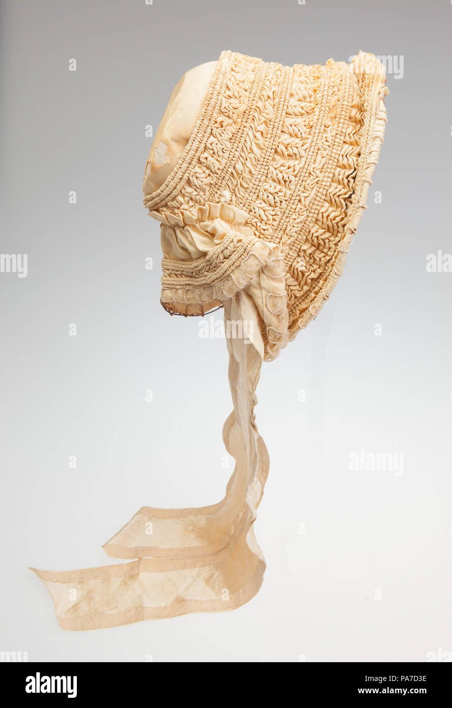 English: Woman's gold bibi bonnet Title: Gold Ruched Bibi Bonnet . circa  1840 716 Gold Ruched Bibi Bonnet Stock Photo - Alamy