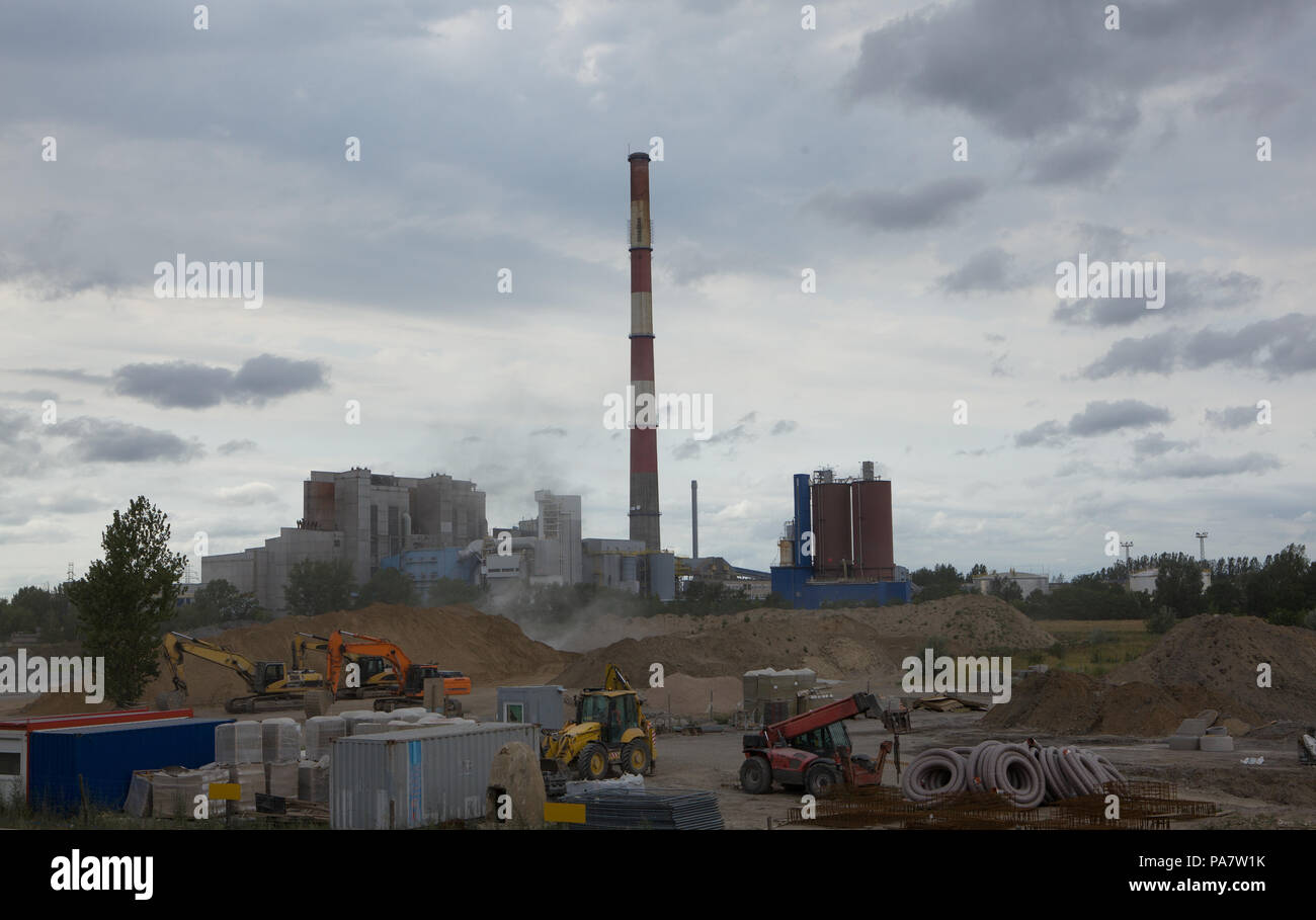 Construction of the factory,Construction site on the background of the factory. Stock Photo