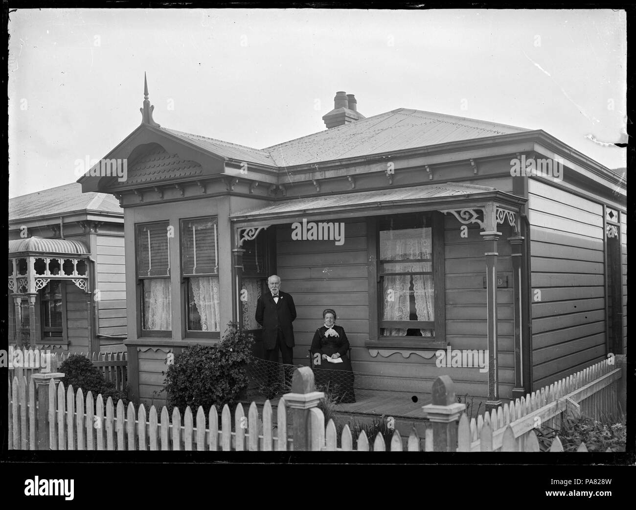 49 Charles and Mary Ann Godber on the verandah of their house at 168 Clyde Street, Island Bay. ATLIB 285529 Stock Photo