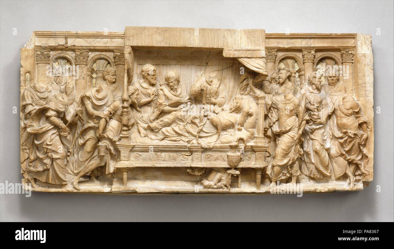 The Dormition of the Virgin. Culture: French, Troyes. Dimensions: Overall (wt. confirmed): 20 1/8 × 43 1/2 × 5 in., 191 lb. (51.1 × 110.5 × 12.7 cm, 86.6 kg). Maker: Jacques Juliot (French, active 1540-52) , and workshop. Date: ca. 1540-50.  In keeping with apocryphal accounts of the Dormition, the Apostles have gathered around the Virgin's deathbed. Closest to her stands Saint John the Evangelist, holding a palm branch; beside him, Saint Peter conducts the service, cradling a book in his arms. Another apostle leans over the foot of the bed to sprinkle holy water; the figure behind him, swingi Stock Photo