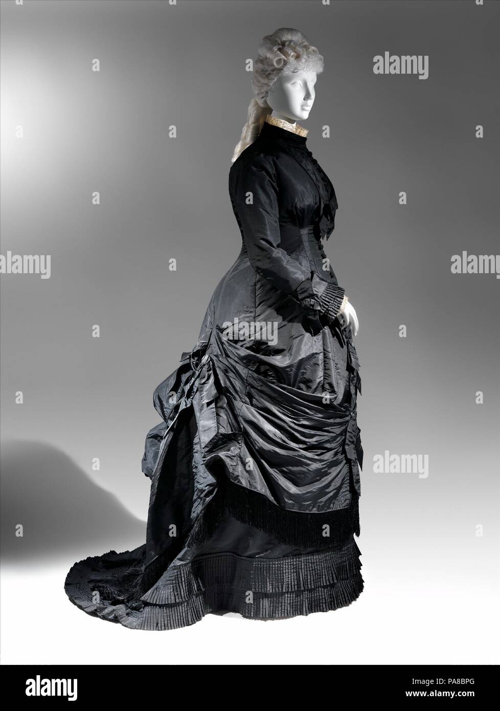 Dress. Culture: American. Manufacturer: Textile by James McCreary and Co.,  N.Y. (American). Date: 1876-78. An hourglass silhouette with a princess-seamed  structure called the "cuirasse" was created with a high waist, just an