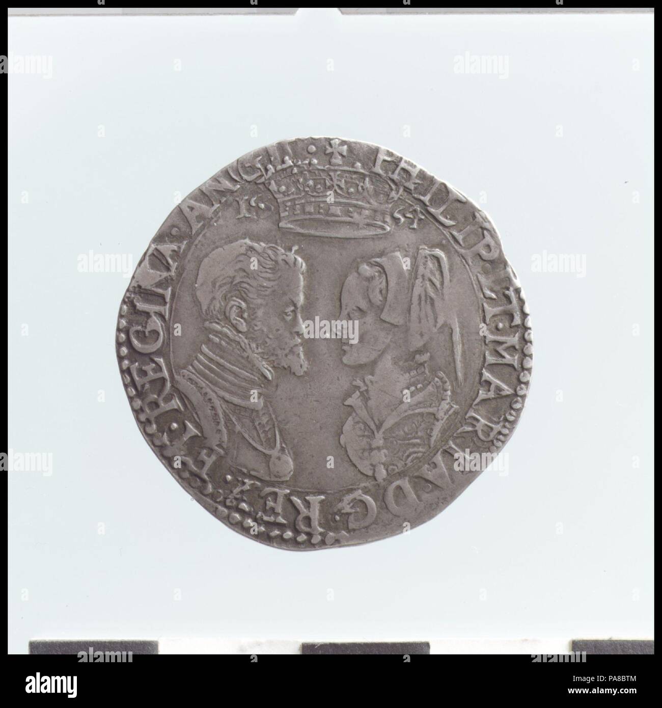Shilling of Philip and Mary. Culture: British. Dimensions: Diameter: 31 mm. Date: 1554.  The supplies of bullion brought to Europe from the New World in the sixteenth and seventeenth centuries caused inflation, and in response new coinage was issued with a wider range of denominations. Gold coins like the sovereign, with the value of one pound, twenty shillings, first appeared in 1489. It was replaced by the unite in 1604 and by the guinea in 1663. Initially minted in gold, the crown was also produced in silver from 1551, with standardized dimensions similar to other European coins. Museum: Me Stock Photo