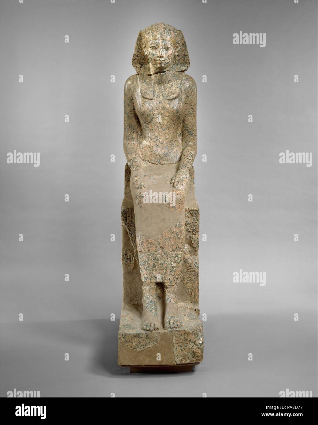 The Female Pharaoh Hatshepsut. Dimensions: H. 170 × W. 41 × D. 90 cm, 620.5 kg (66 15/16 × 16 1/8 × 35 7/16 in., 1368 lb.) (as reassembled). Dynasty: Dynasty 18. Reign: Joint reign of Hatshepsut and Thutmose III. Date: ca. 1479-1458 B.C..  This graceful, life-size statue depicts Hatshepsut in female attire, but she wears the nemes headcloth, a royal attribute usually reserved for the reigning king. In the columns of text inscribed beside her legs on the front of the throne, she has already adopted the throne name Maatkare, but her titles and epithets are still feminine. Thus, she is 'Lady of t Stock Photo